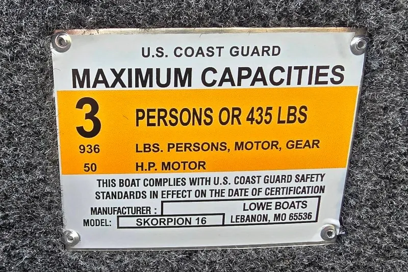 Slide: The Image of Side steering console of 2026 Lowe Skorpion 16 boat with optional gauge package and controls. - 11