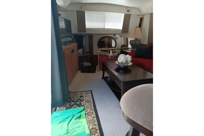 Slide: The Image of Interior of 1996 Harbor Master 52 Wide Body yacht, featuring elegant furnishings and decor. - 24