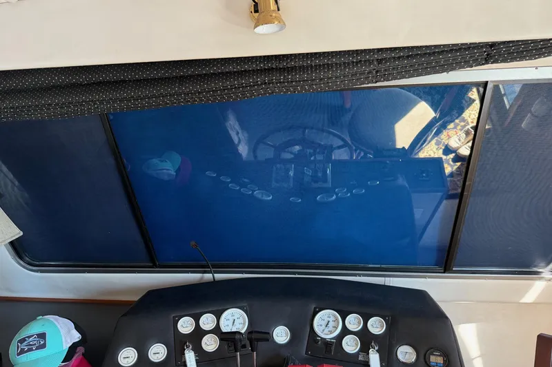 Slide: The Image of Interior view of 1996 Harbor Master 52 Wide Body boat dashboard with gauges and controls. - 31