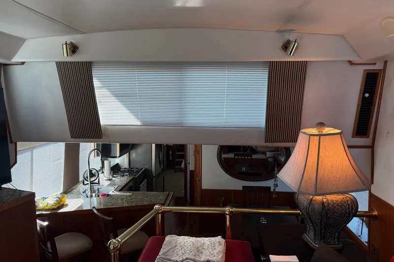 Slide: The Image of Interior of a 1996 Harbor Master 52 Wide Body yacht with kitchen and lamp. - 40