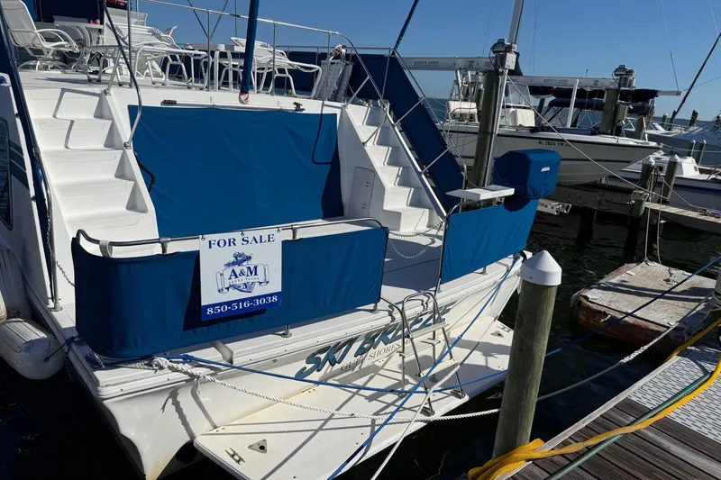 Slide: The Image of 1996 Harbor Master 52 Wide Body yacht for sale at marina dock. - 6