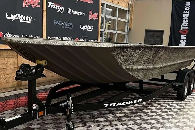 Slide: The Image of 2026 Tracker Grizzly 2072 Utility boat on trailer in showroom. - 3
