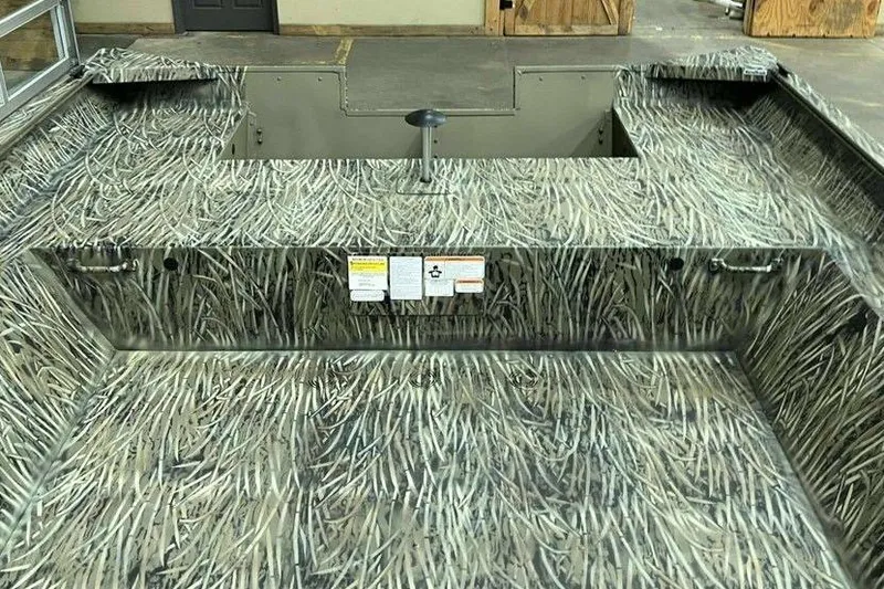 Slide: The Image of 2026 Tracker Grizzly 2072 Utility boat interior with camouflage pattern and storage compartments. - 5