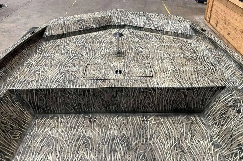 Slide: The Image of 2026 Tracker Grizzly 2072 Utility boat with camouflage interior design. - 6