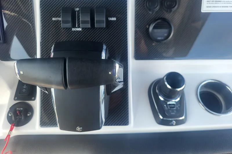 Slide: The Image of Control panel of 2025 Fountain 34 SC boat with throttle and joystick. - 15