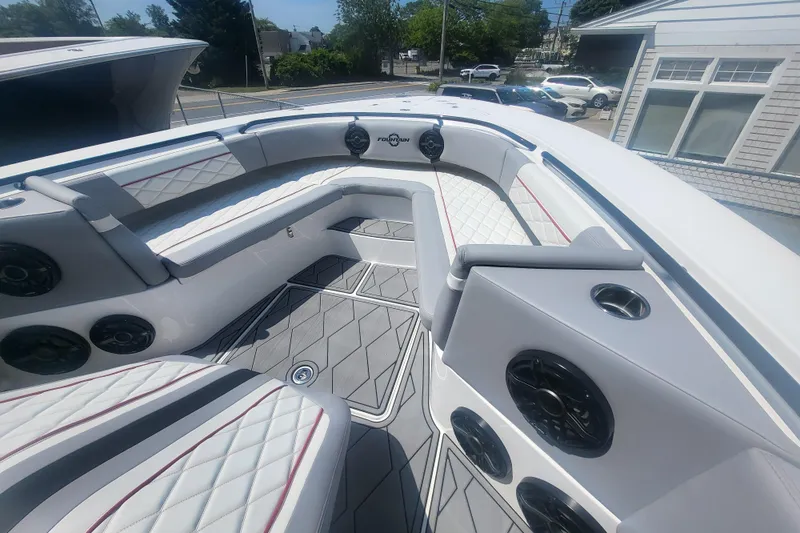 Slide: The Image of 2025 Fountain 34 SC boat interior with luxurious seating and modern audio system. - 21