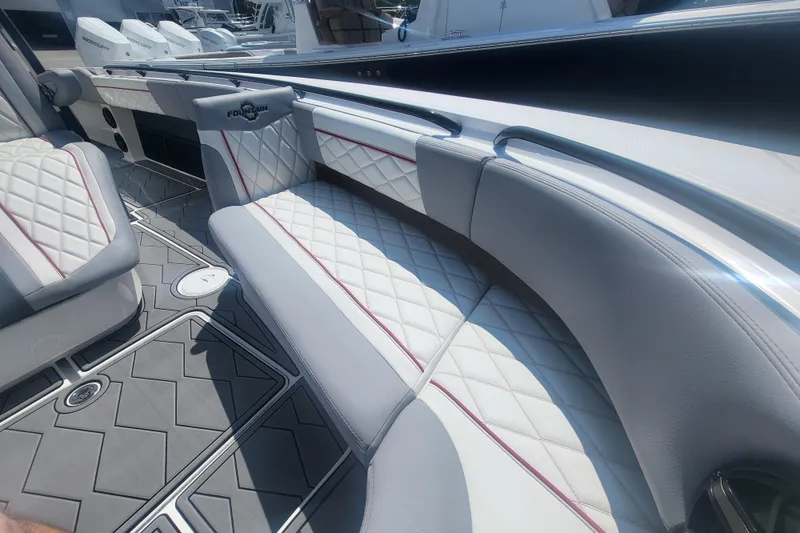 Slide: The Image of Luxurious seating on 2025 Fountain 34 SC boat with quilted upholstery and sleek design. - 23