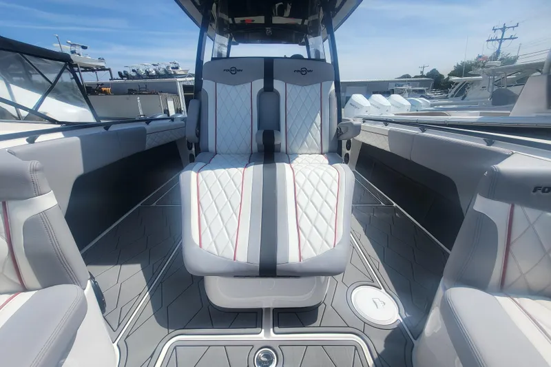 Slide: The Image of 2025 Fountain 34 SC boat interior with luxurious seating and modern design. - 25