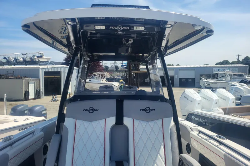 Slide: The Image of 2025 Fountain 34 SC boat interior with sleek design and modern features at a marina. - 27