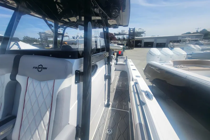 Slide: The Image of 2025 Fountain 34 SC boat interior with sleek seating and modern design. - 29