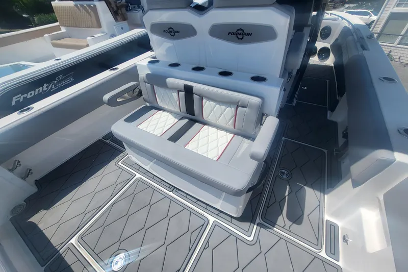 Slide: The Image of 2025 Fountain 34 SC boat interior with cushioned seating and modern design. - 30