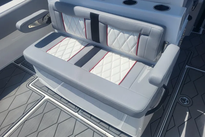 Slide: The Image of 2025 Fountain 34 SC boat seating with quilted upholstery and armrests. - 31