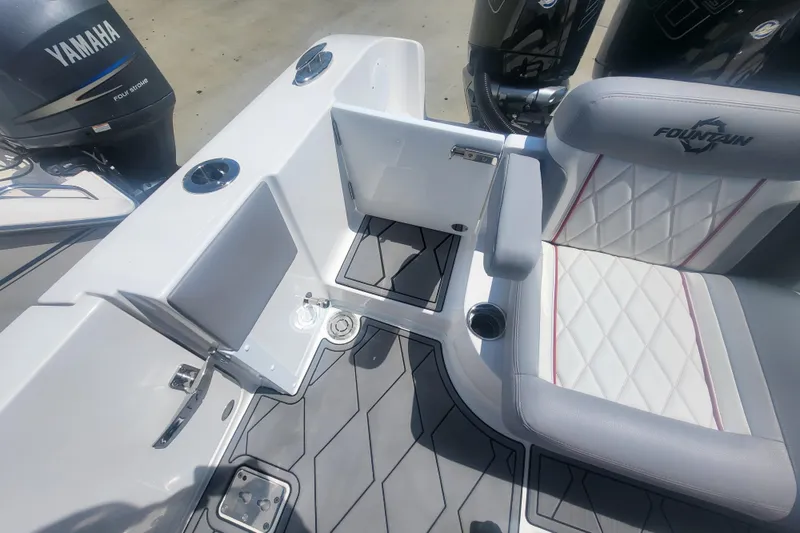 Slide: The Image of 2025 Fountain 34 SC boat interior with Yamaha engine, featuring sleek seating and modern design. - 33