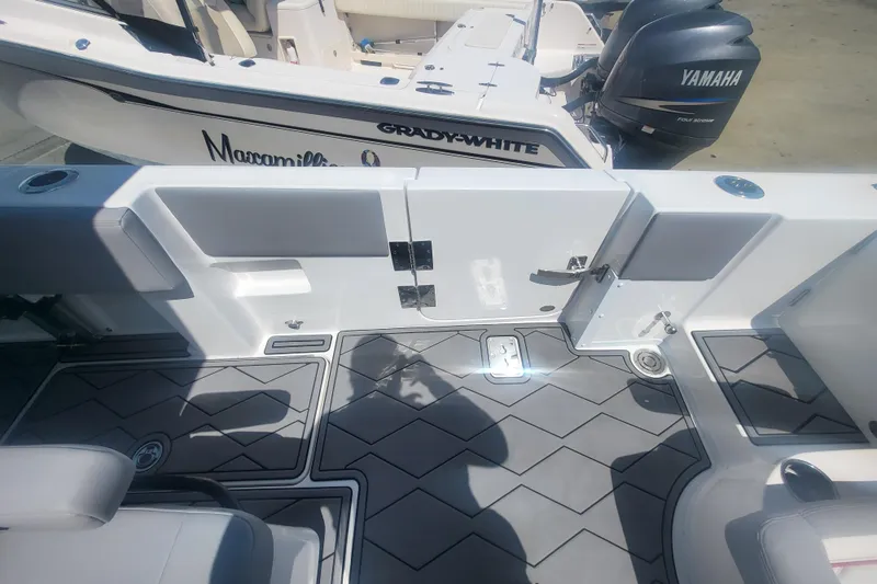 Slide: The Image of 2025 Fountain 34 SC boat interior with Yamaha engine and Grady-White branding. - 34