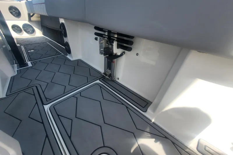 Slide: The Image of 2025 Fountain 34 SC boat interior with geometric flooring and seating. - 35