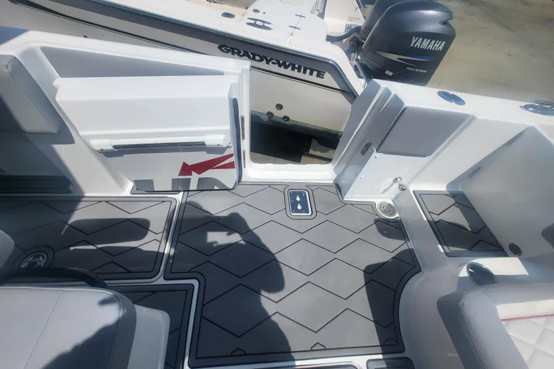 Slide: The Image of 2025 Fountain 34 SC boat interior with Yamaha engine and Grady-White branding. - 36