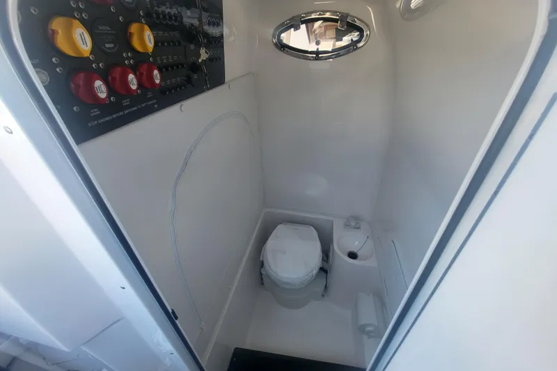 Slide: The Image of Interior of 2025 Fountain 34 SC boat bathroom with control panel. - 38