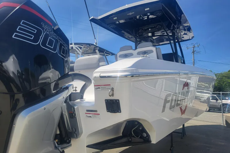 Slide: The Image of 2025 Fountain 34 SC boat with powerful 300 engine, sleek design, and modern features. - 4
