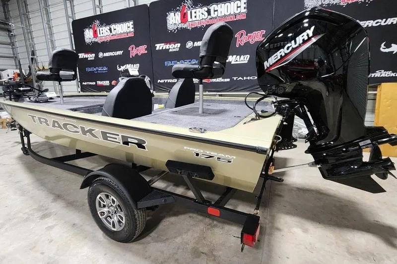 Slide: The Image of 2026 Tracker Pro Team 175 boat with Mercury engine in showroom. - 3