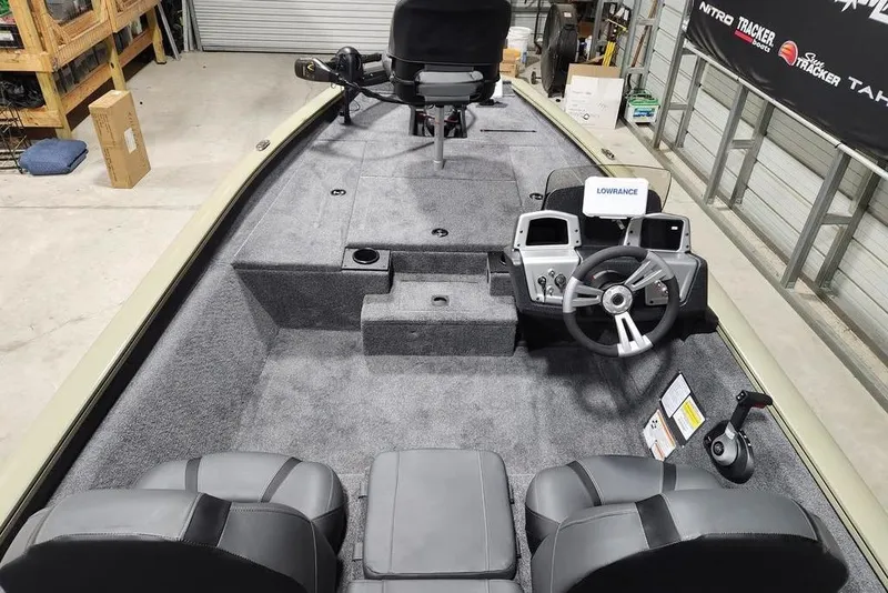 Slide: The Image of 2026 Tracker Pro Team 175 boat interior with steering console and seating. - 6