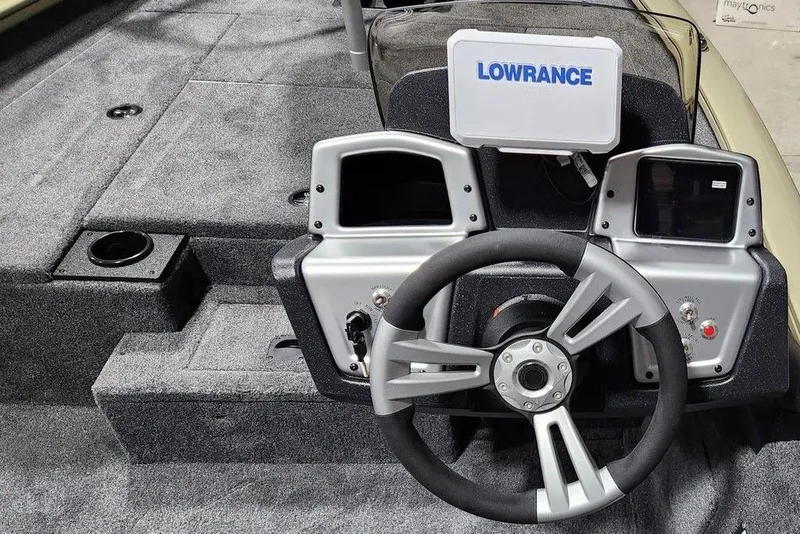 Slide: The Image of 2026 Tracker Pro Team 175 boat dashboard with Lowrance electronics and steering wheel. - 7