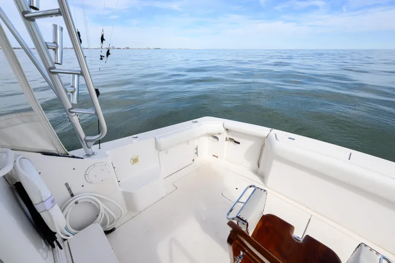 Slide: The Image of 1998 Bertram 36 Moppie boat deck with ocean view and fishing equipment. - 11