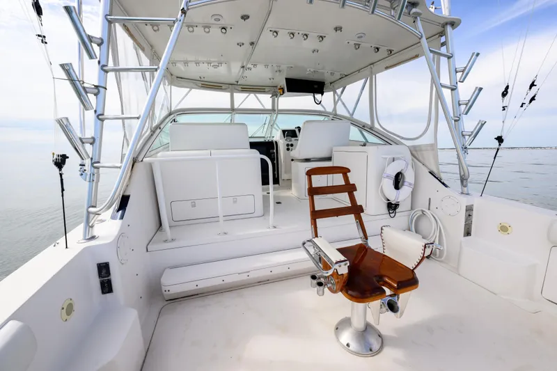 Slide: The Image of 1998 Bertram 36 Moppie yacht interior with fishing chair and helm station. - 8