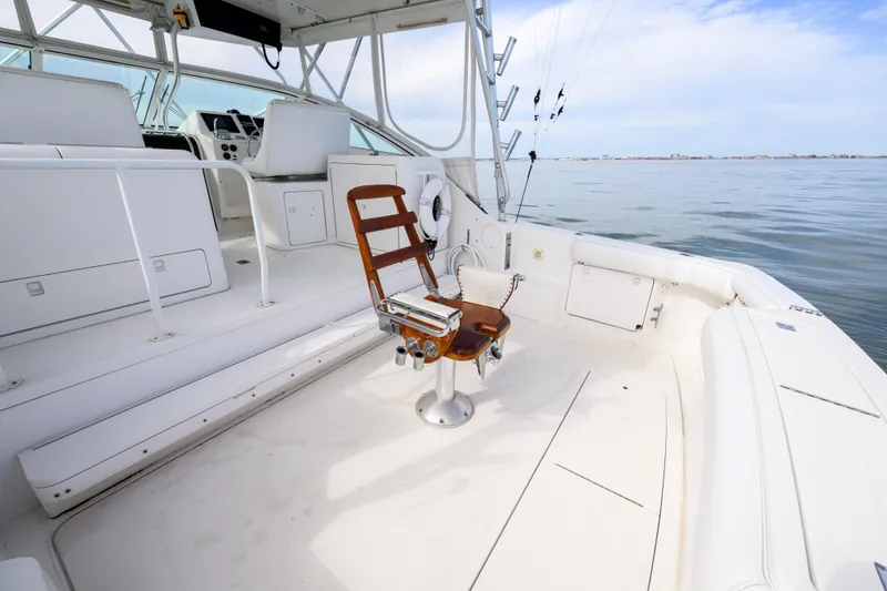Slide: The Image of 1998 Bertram 36 Moppie boat interior with fishing chair and ocean view. - 9