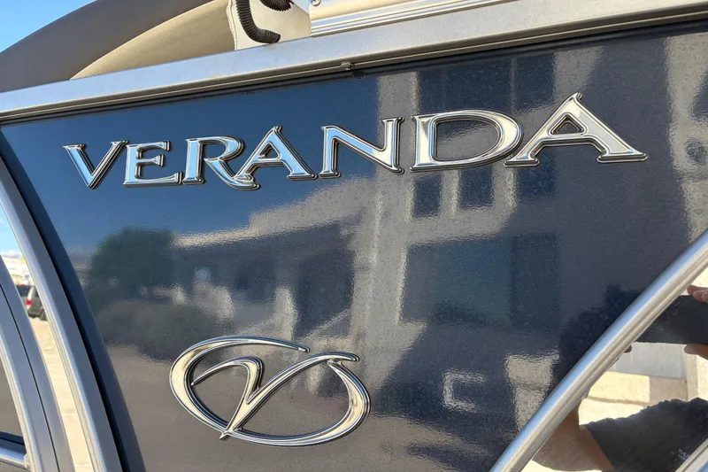 Slide: The Image of 2017 Veranda Relax V2275RFL boat logo on a reflective surface. - 5