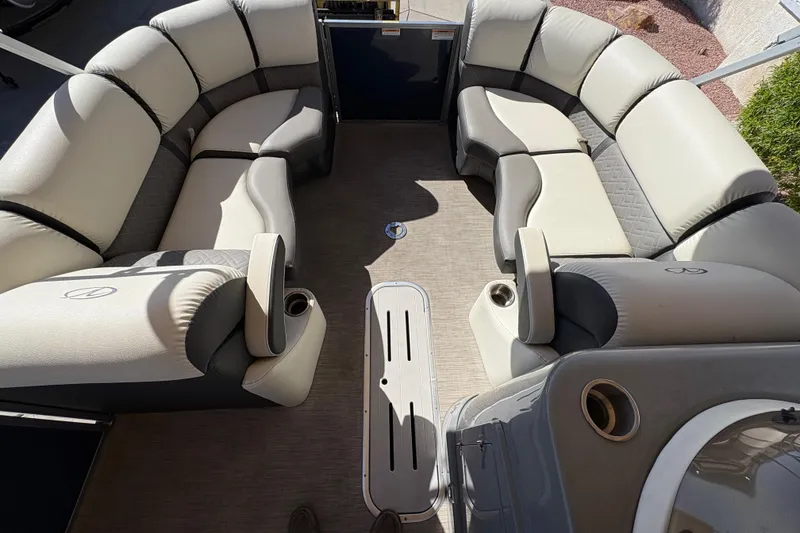 Slide: The Image of 2017 Veranda Relax V2275RFL pontoon boat interior with plush seating and cup holders. - 7