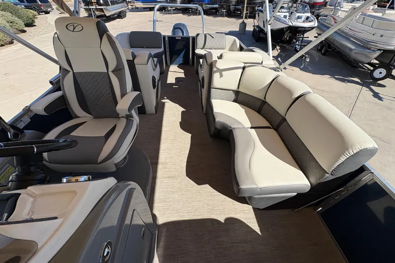 Slide: The Image of 2017 Veranda Relax V2275RFL pontoon boat interior with luxurious seating and steering console. - 8