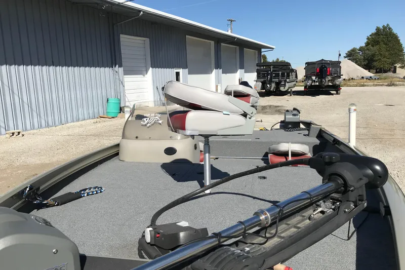 Slide: The Image of 2007 Lowe Stinger 170 boat parked outdoors near a building. - 19