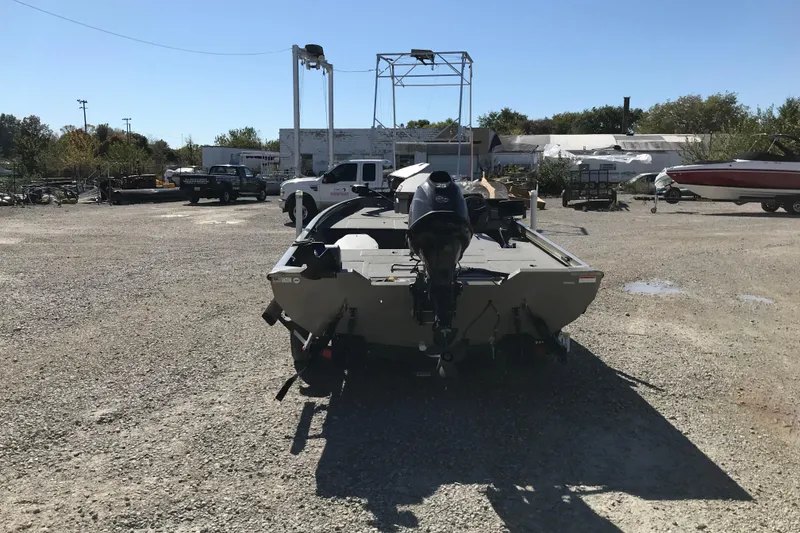 Slide: The Image of 2007 Lowe Stinger 170 boat in a gravel lot, rear view. - 8