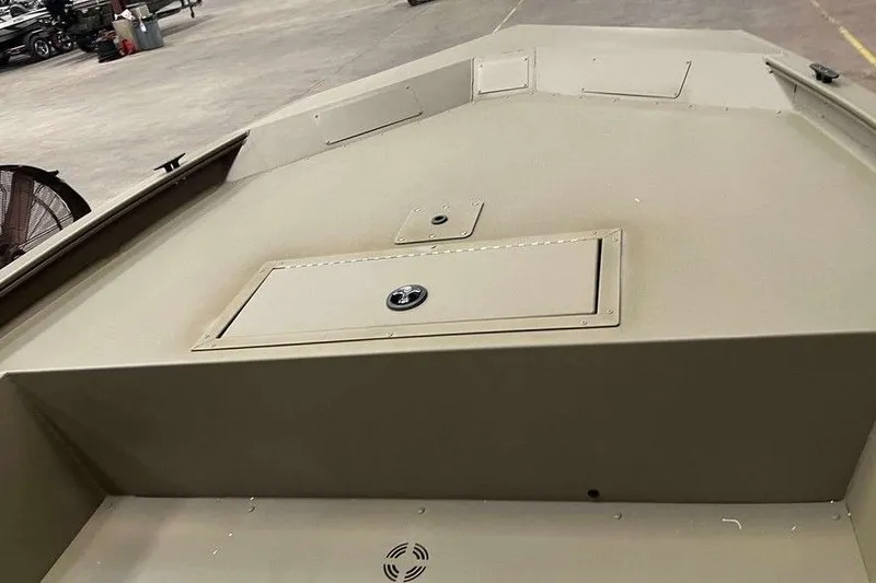 Slide: The Image of 2026 Tracker Grizzly 1754 Utility boat interior, featuring storage compartment and durable design. - 4