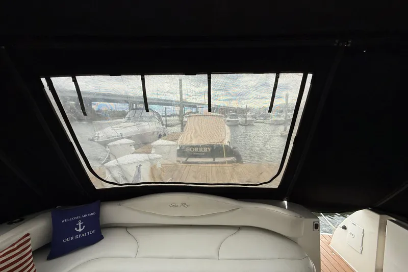 Slide: The Image of Interior view of a 2001 Sea Ray 410 Sundancer yacht at a marina. - 21
