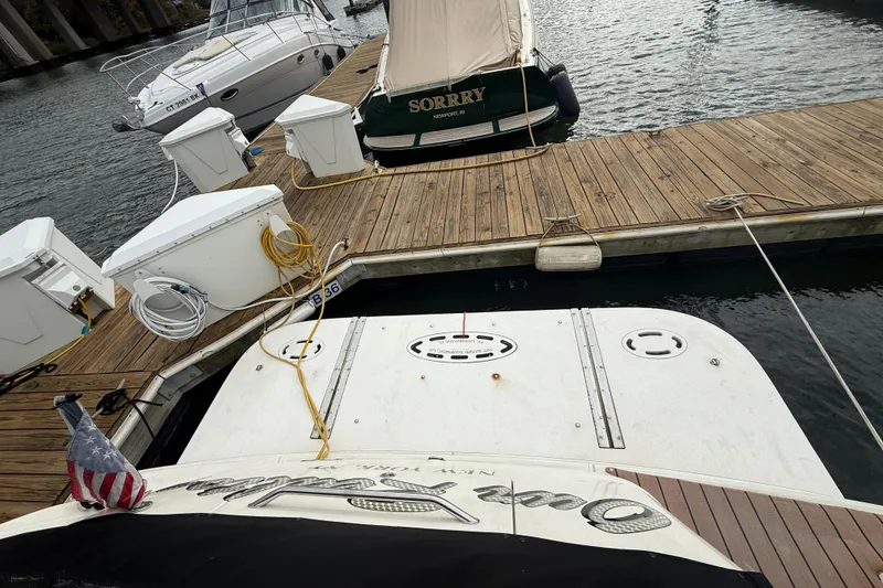 Slide: The Image of 2001 Sea Ray 410 Sundancer docked at marina with other boats. - 22