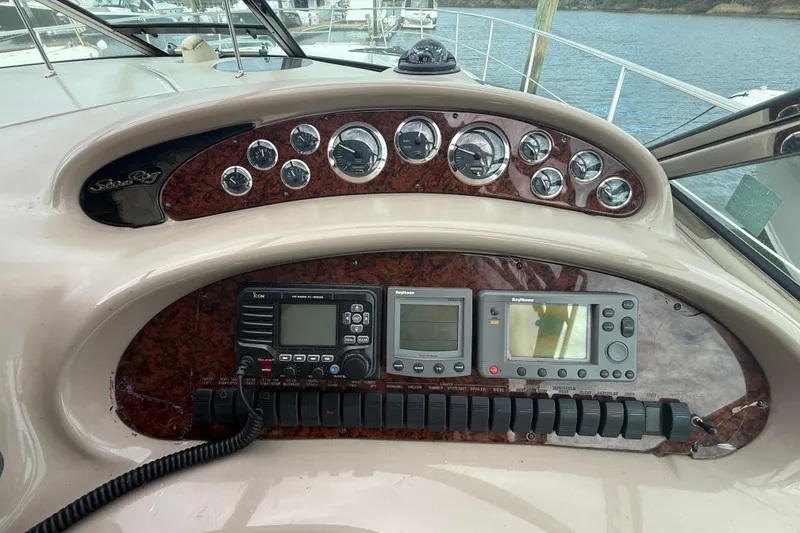 Slide: The Image of Control panel of a 2001 Sea Ray 410 Sundancer yacht with navigation instruments. - 7