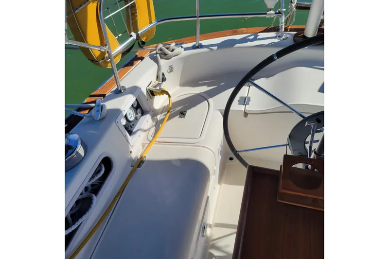 Slide: The Image of Cockpit of 1984 Pearson 386 sailboat with steering wheel and safety equipment. - 19