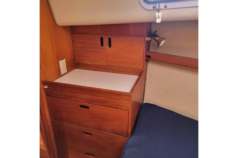 Slide: The Image of Wooden interior of 1984 Pearson 386 sailboat with drawers and reading light. - 35