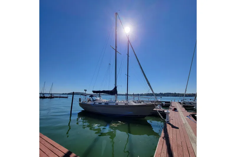 Slide: The Image of 1984 Pearson 386 sailboat docked under clear blue sky. - 47