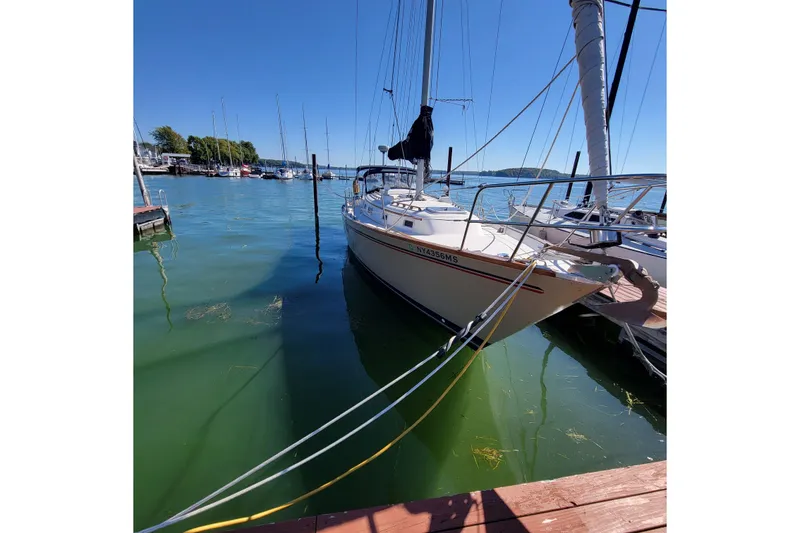 Slide: The Image of 1984 Pearson 386 sailboat docked in a marina on a sunny day. - 7