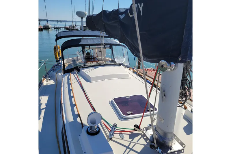Slide: The Image of 1984 Pearson 386 sailboat deck with rigging and cockpit view at marina. - 9