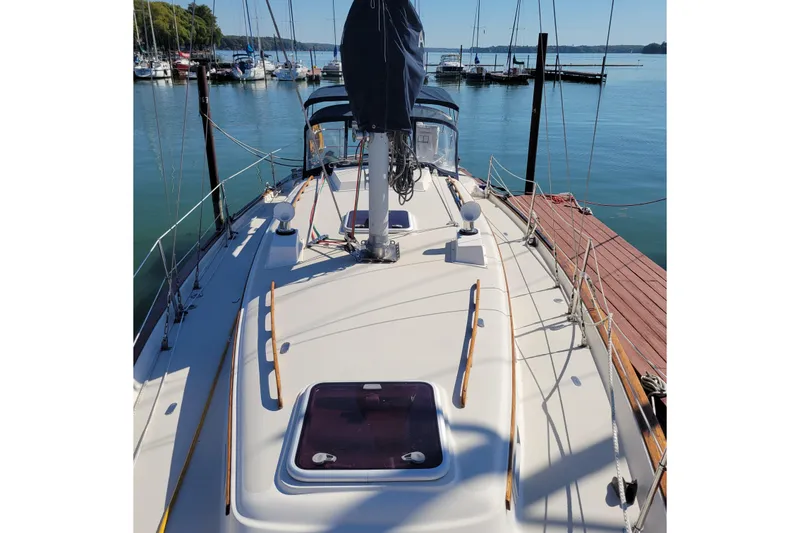 Slide: The Image of 1984 Pearson 386 sailboat docked at marina, clear day, calm water. - 10