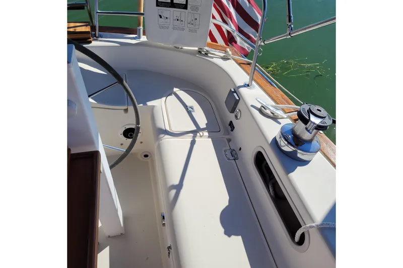 Slide: The Image of Cockpit of 1984 Pearson 386 sailboat with steering wheel and winch. - 21