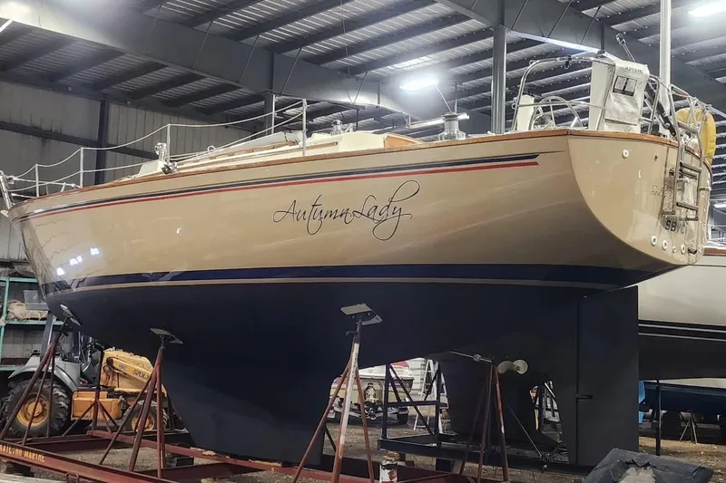 Slide: The Image of 1984 Pearson 386 sailboat "Autumn Lady" in a boatyard, elevated on stands. - 43