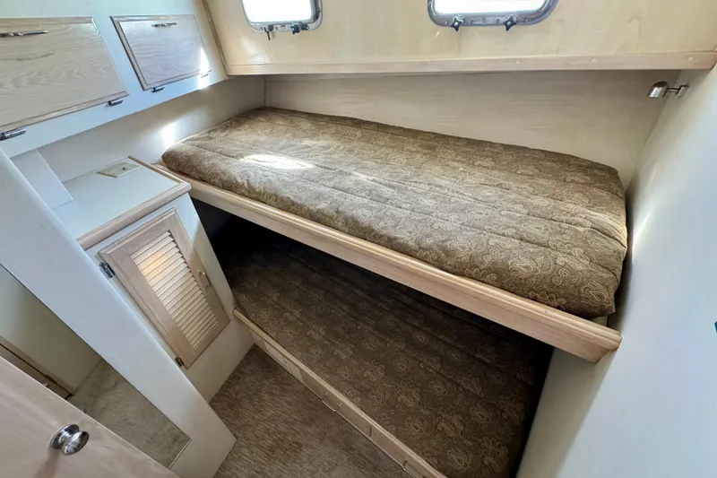 Slide: The Image of Curved wooden staircase with decorative vase on 1993 Tollycraft 57 Pilothouse Motor Yacht. - 18