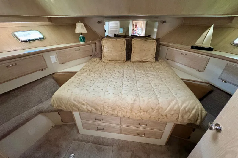 Slide: The Image of Bunk beds in 1993 Tollycraft 57 Pilothouse Motor Yacht cabin, featuring patterned bedding. - 20