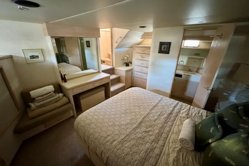 Slide: The Image of Cozy bedroom in 1993 Tollycraft 57 Pilothouse Motor Yacht with elegant decor and soft lighting. - 27