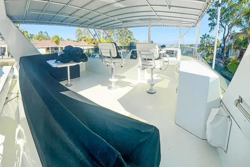 Slide: The Image of Luxurious bedroom interior of 1993 Tollycraft 57 Pilothouse Motor Yacht with elegant furnishings. - 34