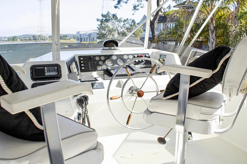 Slide: The Image of Pilothouse interior of 1993 Tollycraft 57 Motor Yacht with steering wheel and captain's chairs. - 37